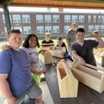 Kids working to build a tool box 4