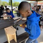 Kids working to build a tool box 8