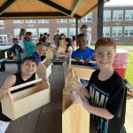 Kids working to build a tool box 11